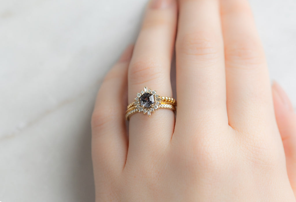 The Compass Ring with a Violet Grey Spinel with Stacking Bands on Model