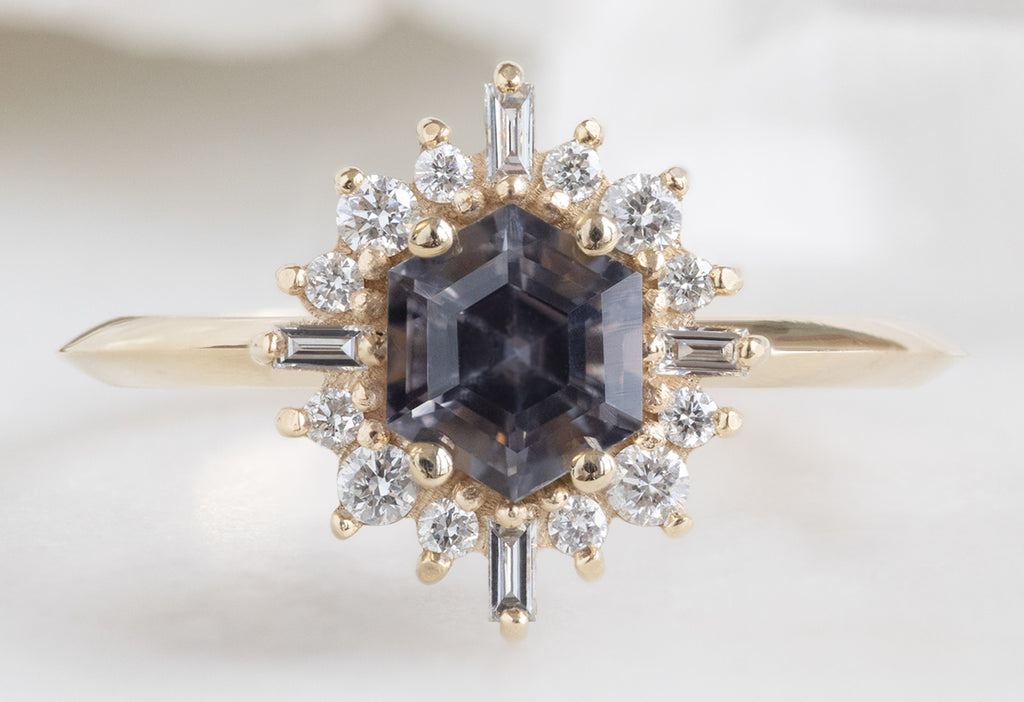 The Compass Ring with a Violet Grey Spinel
