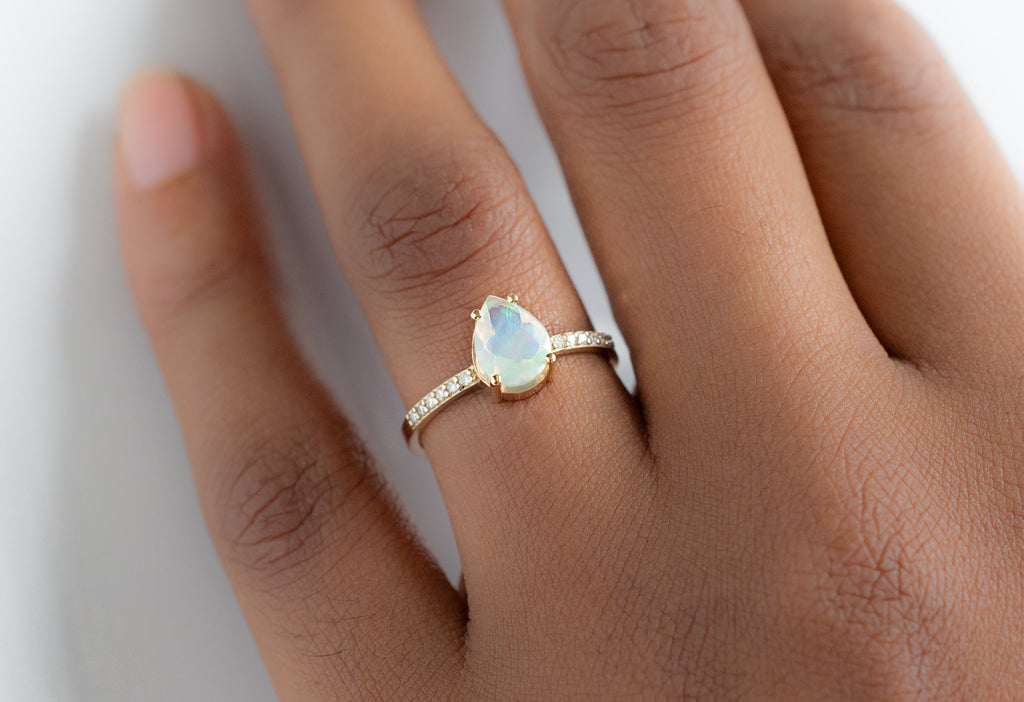 The Willow Ring with a Pear-Cut Opal on Model